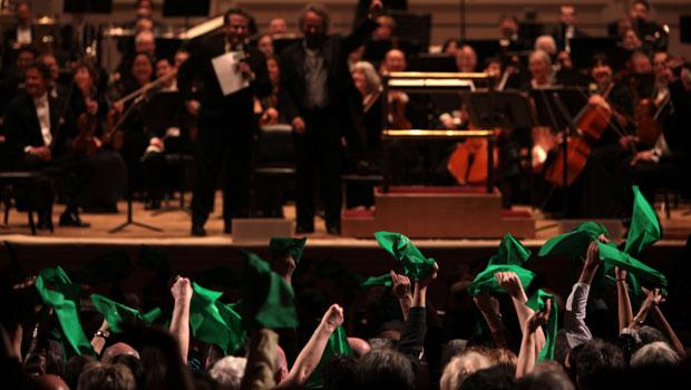 The hometown crowd from Oregon creates a palpable excitement in the hall, showing their support with green handkerchiefs. The hometown crowd from Oregon creates a palpable excitement in the hall, showing their support with green handkerchiefs.