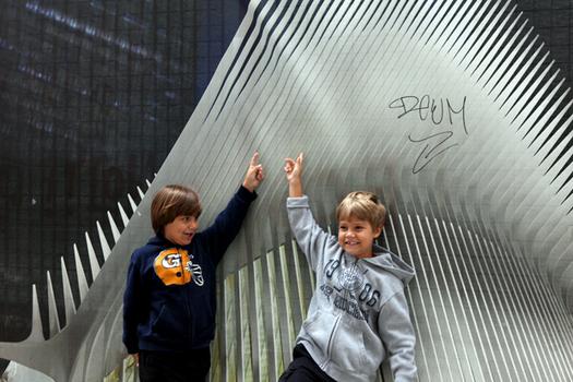 Parents brought their children down to Ground Zero to see the construction and the site of the 9/11 attacks. Parents brought their children down to Ground Zero to see the construction and the site of the 9/11 attacks.