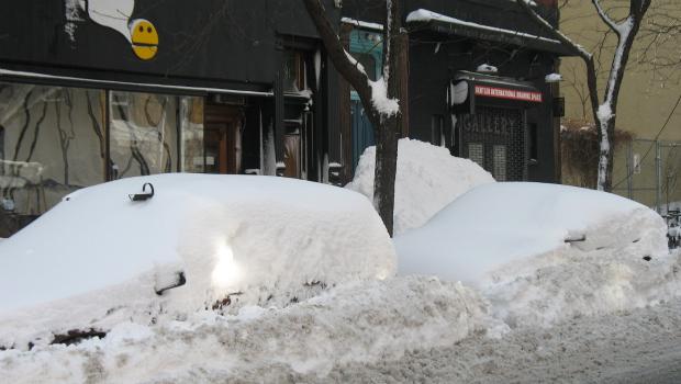 Thursday's snow storm blanketed cars with snow. Thursday's snow storm blanketed cars with snow.