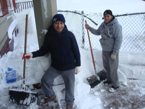 Two men clear snow from a Crown Heights walkway on January 27, 2011. Two men clear snow from a Crown Heights walkway on January 27, 2011.