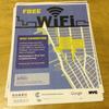 A handbill announcing the free outdoor WiFi network that stretches across parts of Chelsea and the Meatpacking District on a desk in the Robert Fulton Houses, a NYCHA complex