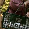 Customer fills Whole Foods shopping basket with food