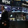 Traders work on the floor of the New York Stock Exchange during afternoon trading on October 4, 2012.