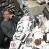 Host John Schaefer proudly displays the famous desk