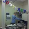 Host John Schaefer reaches for stash of dark chocolate, in his office with the famous desk Schaefer habitat 2011 -30 years!