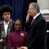 Bill de Blasio takes the oath of office, administered by Bill Clinton, on the steps of City Hall on January 1st, 2014