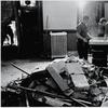 American construction workers and policemen stand around a pile of rubble in the police headquarters building after a bombing by the Weathermen Underground Organization. June 9, 1970