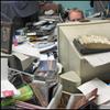 Host John Schaefer cleverly camouflages himself with his desk full of CD submissions
