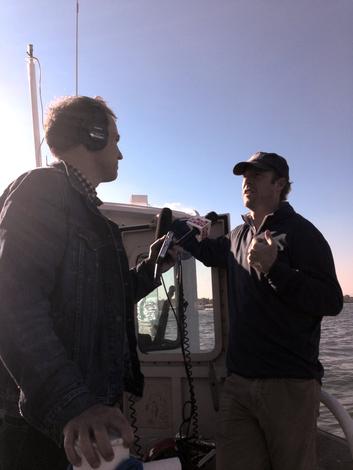 WNYC's Matthew Schuerman interviewing Harbor School co-founder Murray Fisher on the Hudson River for the NYC 2050 series.