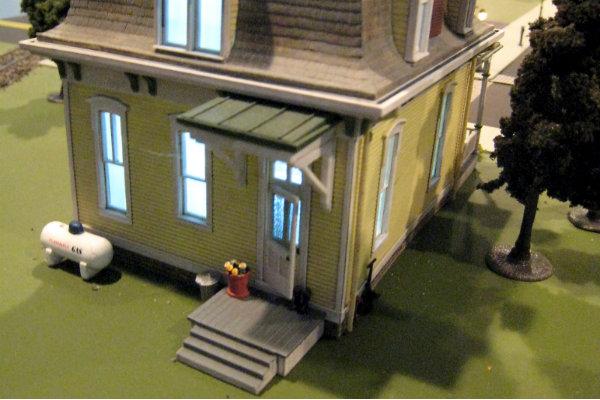 Skoudis is proud of the details within Cyber City like this house with a flowerpot. While he doesn’t want human figures in the model, those details reminds him that people’s livelihoods are at stake.