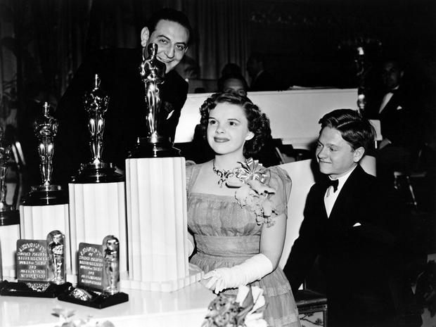 Guy Lombardo, Judy Garland and Mickey Rooney, 1939 (12th) Academy Awards (Garland received a Special Award - a miniature statuette - 'for her outstanding performance as a screen juvenile')