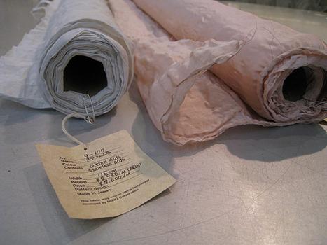 The tag on one of NUNO's fabrics marks its composition as 40% cotton, 60% stainless steel. The material on the right is made, in part, from copper telephone wire.