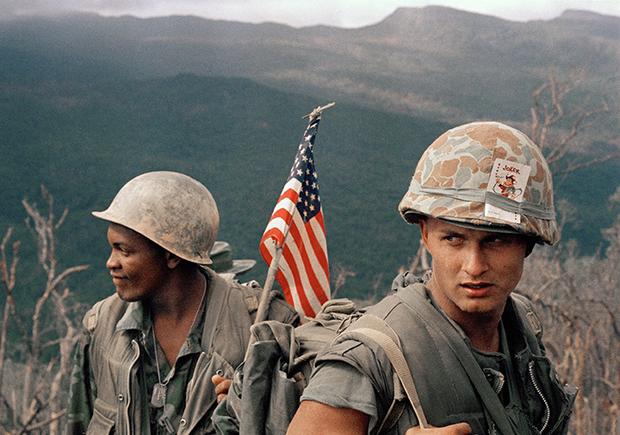 Marines move through a landing zone, December 1969.