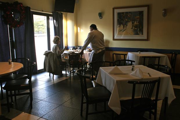 A customer chats with the chef at Cafe Luna.
