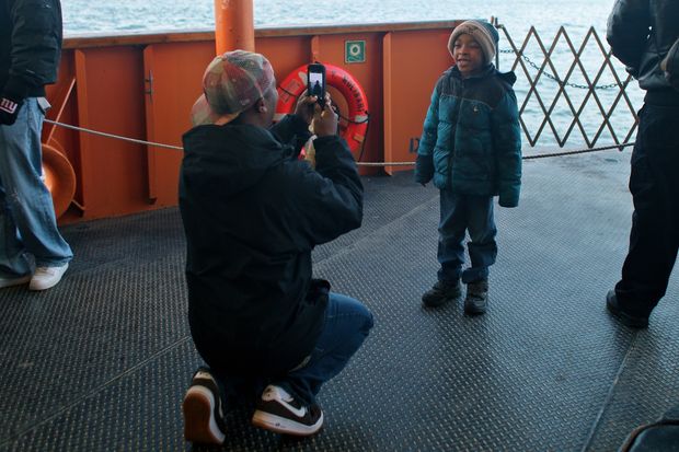 Saying, 'che-e-e-e-ese,' on the Staten Island Ferry.