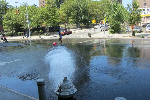 Open hydrant in the South Bronx, E. 149th Street on July 18, 2013