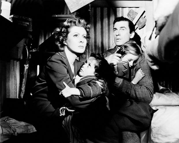 Greer Garson in 'Mrs. Miniver,' 1942. Greer Garson and Walter Pidgeon clutch their children (Christopher Severn and Clare Sanders) during an air raid. Greer Garson in