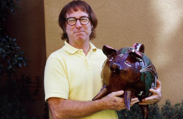 Iconic male chauvinist Bobby Riggs is presented with a pig by Rosie Casals.