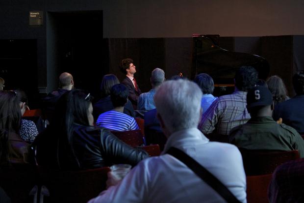 David Byrne (in white) is in the audience as Timo Andres performs in the BAMcafé on the first day of the 2013 Crossing Brooklyn Ferry festival.