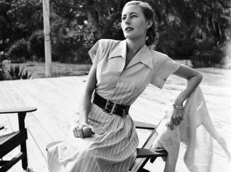 Claire McCardell with a 'Monastic' dress, a waistless, dartless shirt dress, 1946