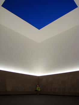 Turrell's Open Sky lets visitors observe a square of sky from a stone bench in a 25-foot-high room.