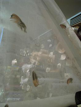 Reiko uses pheasant feathers, discarded from a Chinese restaurant, in this silk-based fabric.