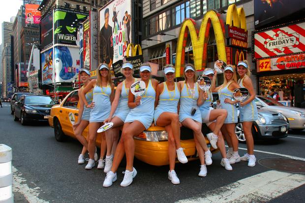 A chorus of Maria Sharapova look-alikes poses in Time Square during the US Open. Art Sietz suggested they sit on the cab.
