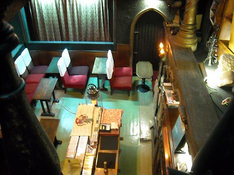 The Lion operates as a cafe, but the dark wood paneling and rows of wooden benches make it feel more like a chapel.