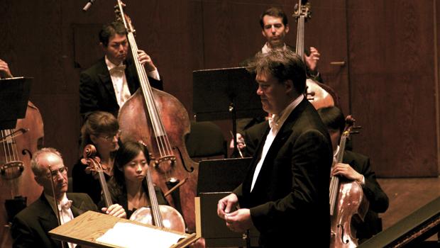 New York Philharmonic conductor Alan Gilbert grins during Wednesday's performance.