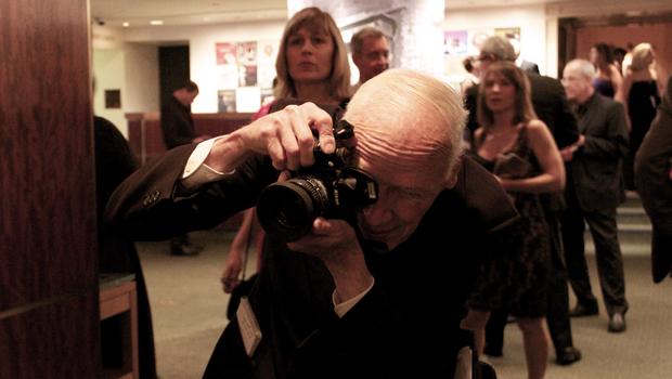 Longtime New York Times fashion photographer Bill Cunningham doing his thing at the Carnegie Hall season opener gala.