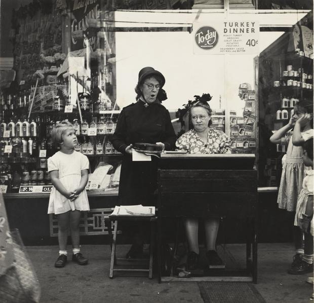 Salvation Army Lassie in Front of a Woolworth Store