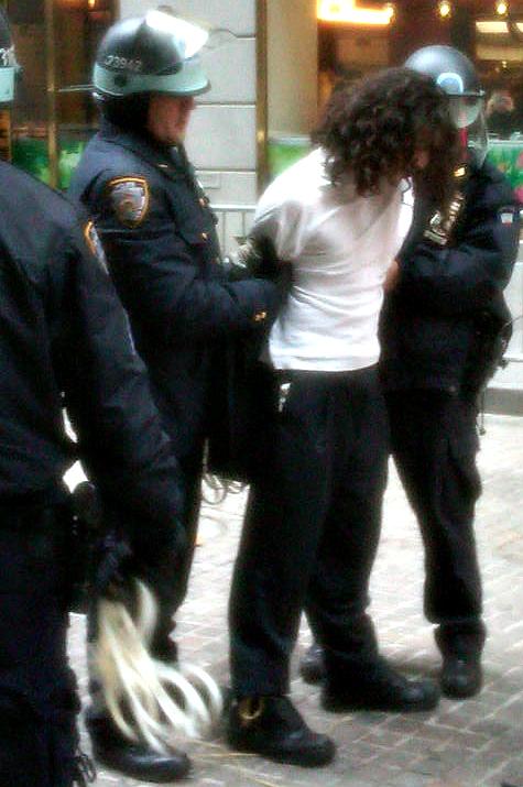 A protester is arrested near Wall Street and Exchange Place.