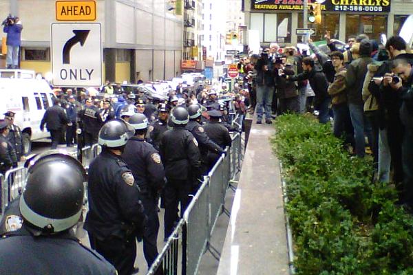 Protesters and police in the Financial District