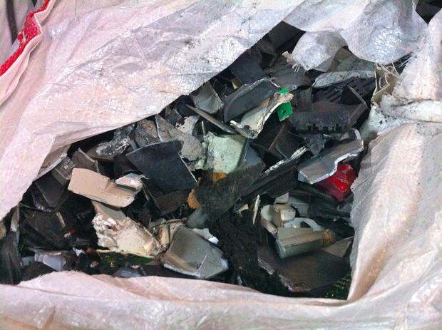 Shredded pieces of plastic from e-waste are grouped together and bagged. We Recycle! will sell the pieces to other recyclers, who will melt the plastic down to make new products and devices.