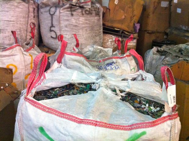 A bag full of shredded circuit boards is ready to be sold to another recycler, who will recover precious metals from the boards.