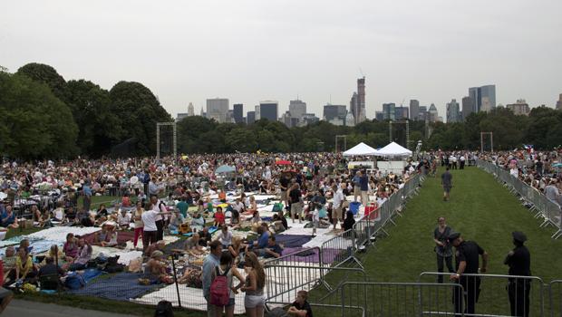 Central Park's Great Lawn fills up with picnickers.