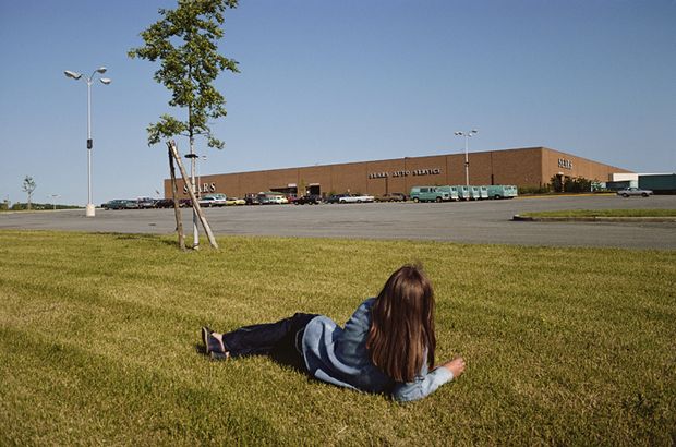 Recalling Andrew Wyeth's famous 1948 painting, 'Christina's World,' Sternfeld depicts a young girl outside of a Sears store in New Jersey in 1980.