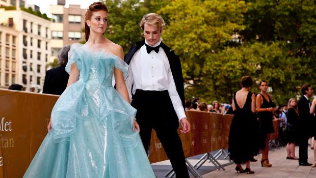 Fashion designer Austin Scarlett and guest arrive at the opening night gala.