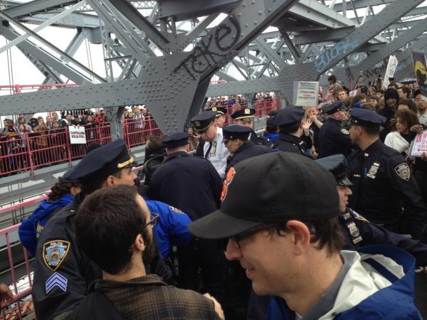 Police and protesters on the Williamsburg Bridge.