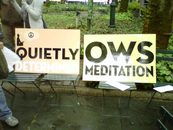 Protesters set up signs at Bryant Park.