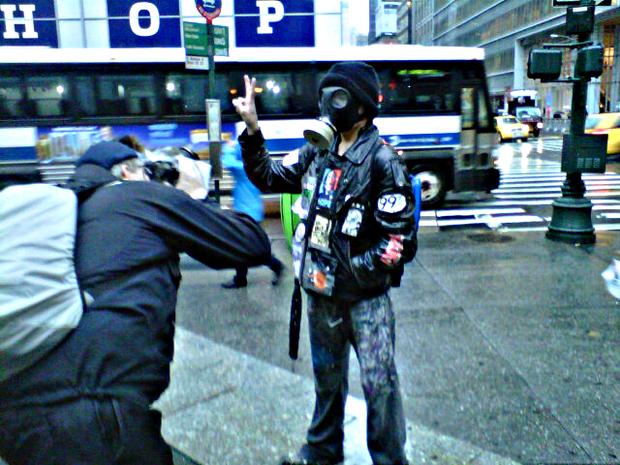 Chris Guerra, 27, artist and leader of OWS black knights on corner of 6th Ave and 42nd Street. (Brigid Bergin/WNYC)
