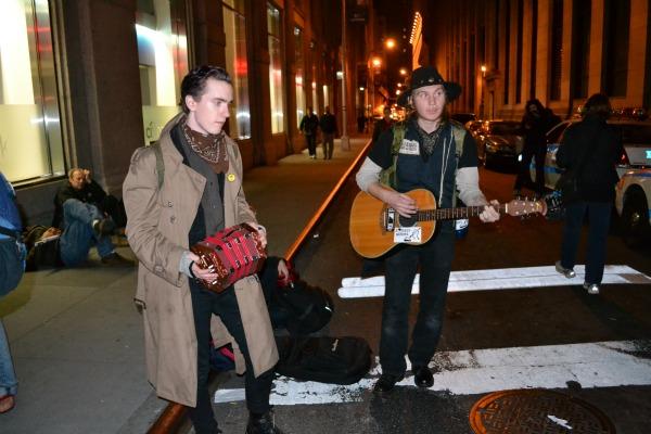 Protesters pass the time at Broadway and Pine streets with a little music