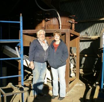 Frank and Ruth Polifka standing in front of the large Windhexe.