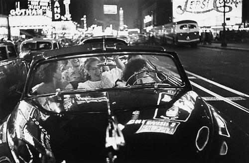 A show about corporations explores ways in which we relate to these faceless entitites. Louise Faurer's 1949 print of young women in Times Square shows a romantic view of the advertised landscape.