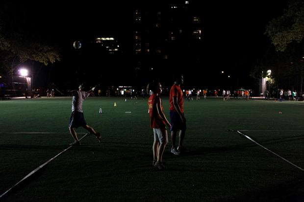 Volleyball and flag football players share a field at the 28th Street park.