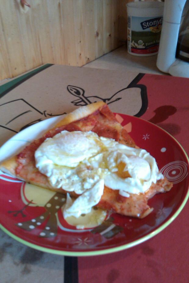 Breakfast? Lunch? Late-night snack?: over easy eggs atop day-old pepperoni pizza