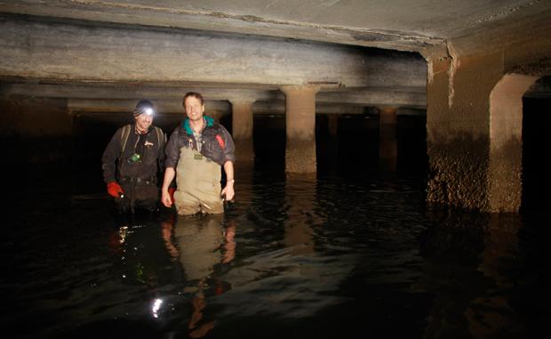 Erling Kagge and Steve Duncan near the end of the trip, in a maze of tunnels at the Jamaica Bay outlet of Queens storm drains. Finally, we can see a light at the end of the tunnel!