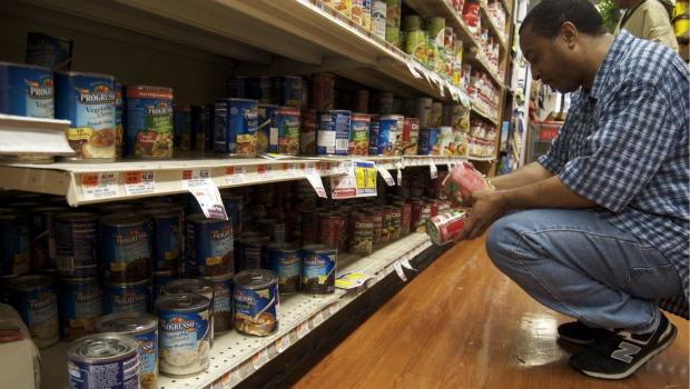 At a Met food market on Nostrand Ave., a customer checks out what's left of the canned soup. At a Met food market on Nostrand Ave., a customer checks out what's left of the canned soup.