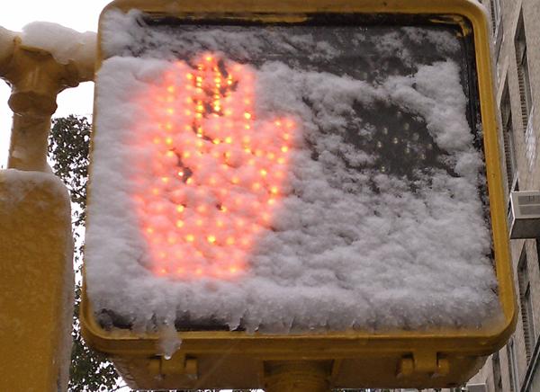 Snow on a walk sign on the Upper West Side. Snow on a walk sign on the Upper West Side.