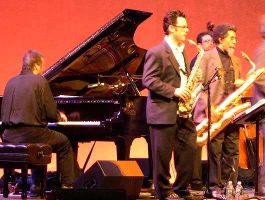 Members of The Either/Orchestra Leo Blanco, piano; Jeremy Udden, alto sax; Kurtis Rivers, baritone sax; (back row) Rick McLaughlin, bass, 11/12/04.